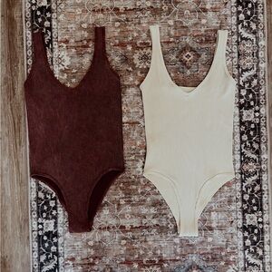 2 bodysuits by AURA